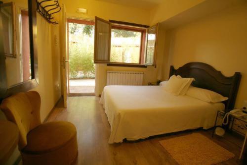 Ένα ή περισσότερα κρεβάτια σε δωμάτιο στο Hotel Torre Marti
