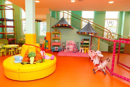 a childs play room with play equipment and toys at Hotel Montecito in Sofia