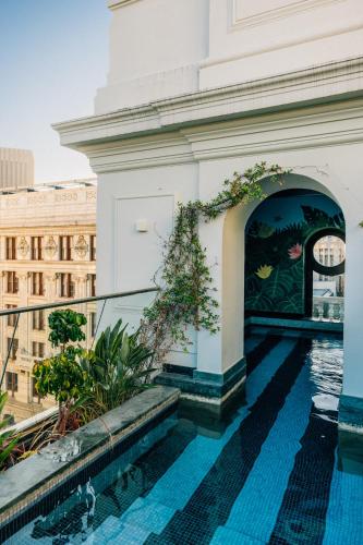 a view from the balcony of a building with a swimming pool at Gorgeous George by Design Hotels ™ in Cape Town