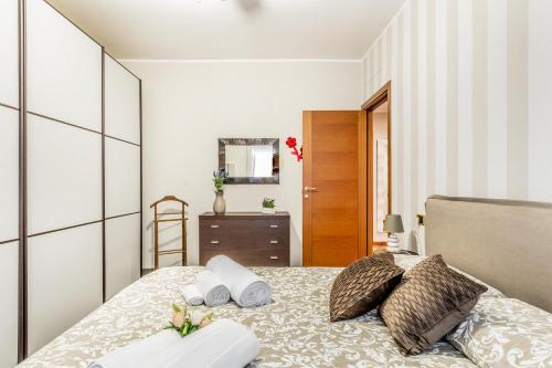 Ένα ή περισσότερα κρεβάτια σε δωμάτιο στο Marilyn House Rho Fiera 10min - Netflix & Design