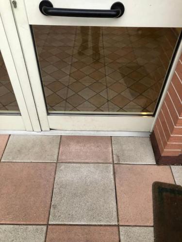 a glass door with a person standing behind it at Da Gianna in Rivalta di Torino