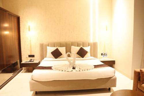 Ένα ή περισσότερα κρεβάτια σε δωμάτιο στο Motel Bilaspur City