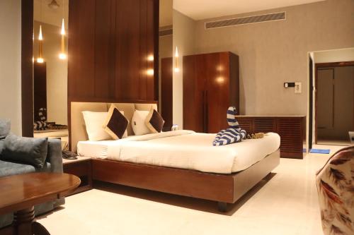 Ένα ή περισσότερα κρεβάτια σε δωμάτιο στο Motel Bilaspur City
