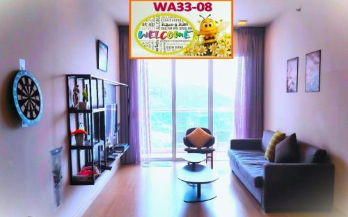 a living room with a couch and a large window at Windmill Upon Hills Premium Suite By Rapi Stay in Genting Highlands