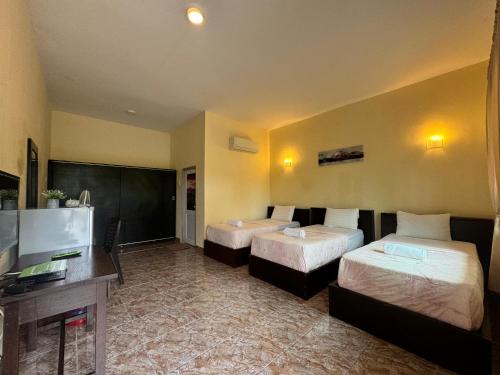 Katil atau katil-katil dalam bilik di DVilla Guesthouse Langkawi
