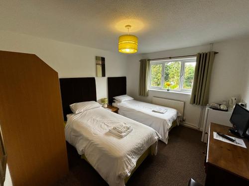 Ein Bett oder Betten in einem Zimmer der Unterkunft Smithaleigh Farm Rooms and Apartments