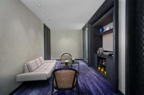 a living room with a couch and a table at Renaissance Bali Nusa Dua Resort in Nusa Dua