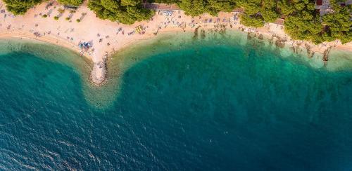an aerial view of a beach and the ocean at Sunny Makarska by Valamar in Makarska