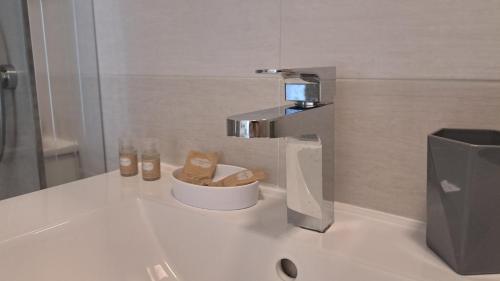 a bathroom sink with a faucet on a counter at Giardino D'Oriente in Otranto