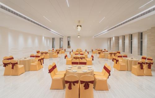 a large room with tables and chairs in it at Baantalai Resort- Baba Balak Nath Shahtalai in Changar Talai