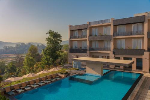 an aerial view of a hotel with a swimming pool at Baantalai Resort- Baba Balak Nath Shahtalai in Changar Talai