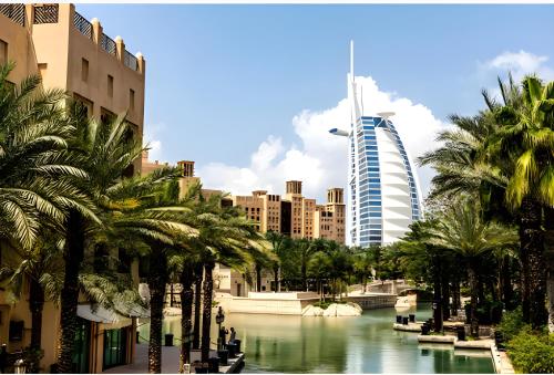 a view of a city with palm trees and a river at Vacay Lettings 2 Bed Retreat near Burj Al Arab in Dubai