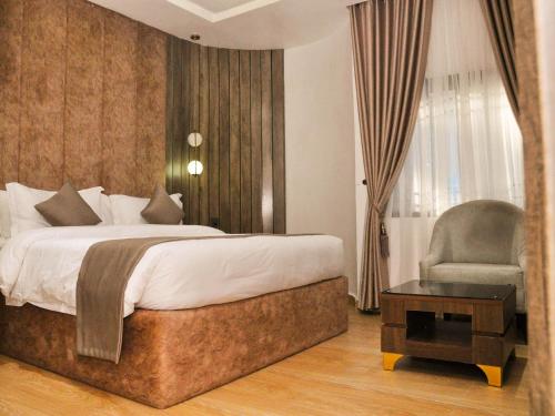 Postel nebo postele na pokoji v ubytování Jukky Hotel Abuja