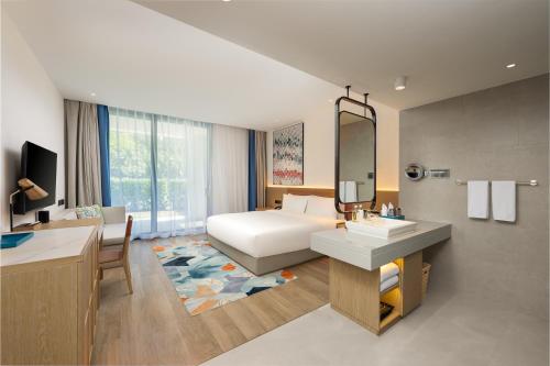Postel nebo postele na pokoji v ubytování Holiday Inn Hainan Xiangshui Bay by IHG