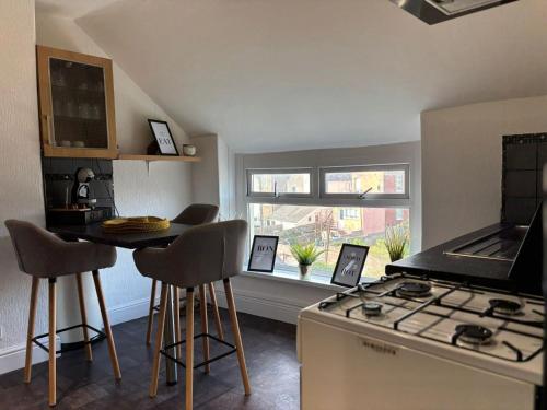 a kitchen with a counter and a stove top oven at Island Heights By MGroupSA in Barry