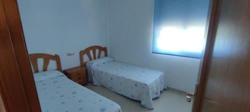 Ένα ή περισσότερα κρεβάτια σε δωμάτιο στο Apartamento turístico El Gato Ngro