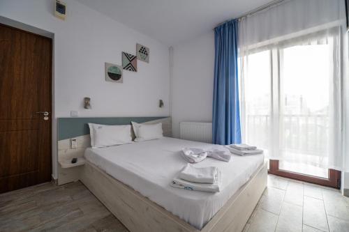 Postel nebo postele na pokoji v ubytování Vila duMio