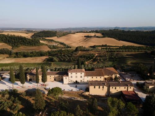 an aerial view of a villa in a village at Villa Petriolo - Small Luxury Hotels of the World in Cerreto Guidi