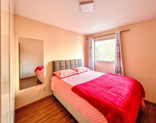 a bedroom with a large bed and a mirror at Apto espacoso c WiFi prox a Marginal Pinheiros SP in Sao Paulo