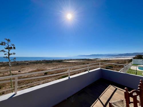 a view of the beach from the balcony of a house at Castillo de Ralph in Guardias Viejas