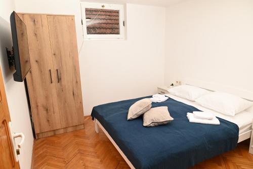 Ένα ή περισσότερα κρεβάτια σε δωμάτιο στο Apartmani Timacum