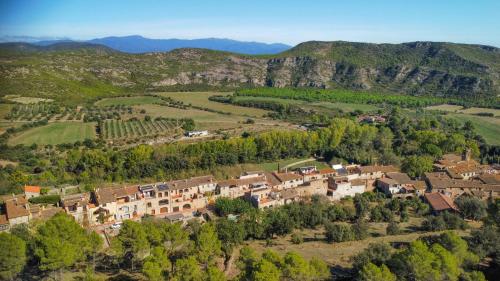 an aerial view of a village in the mountains at Majordoms - Cal Sabater in Las Escaulas