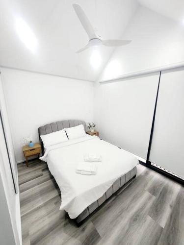 a white bedroom with a bed and a window at Holiday Home on Acreage Block - Next to M1 and Close to Everything in Slacks Creek