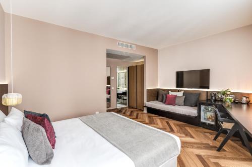 Postel nebo postele na pokoji v ubytování Plinius Lifestyle Hotel Lake Como