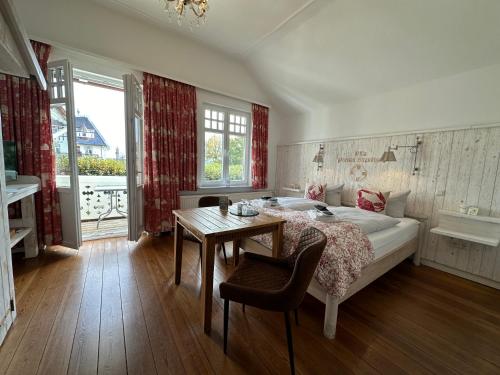 En eller flere senge i et værelse på Villa Pension Strandhaus - adults only
