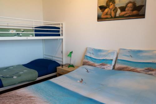a bedroom with a bed and a picture on the wall at Gioiamare in Martinsicuro