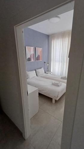 Ένα ή περισσότερα κρεβάτια σε δωμάτιο στο JTower Royal Suites - Alefimmoed