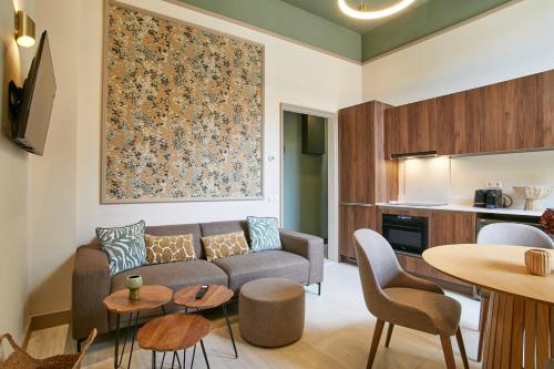 a living room with a couch and a table at Seaside design apartment in Scheveningen