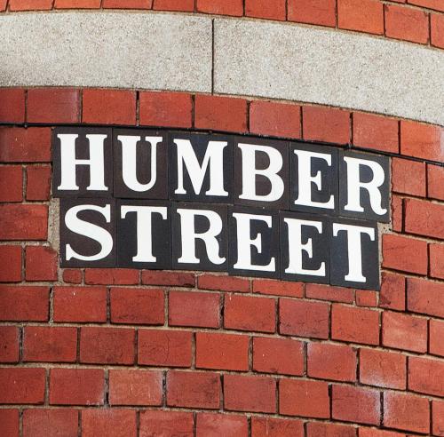a sign on the side of a brick wall at Boutique 1 Bedroom Duplex Suite on Marina-304 in Hull