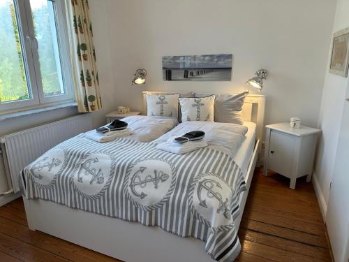 En eller flere senge i et værelse på Villa Pension Strandhaus - adults only