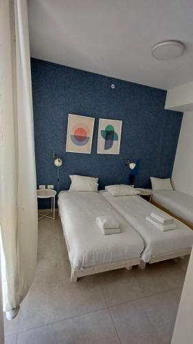 Ένα ή περισσότερα κρεβάτια σε δωμάτιο στο JTower Royal Suites - Alefimmoed