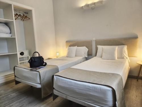 Ένα ή περισσότερα κρεβάτια σε δωμάτιο στο Hotel Casa Dalia