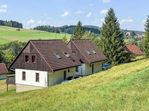 a group of houses on top of a hill at Holiday Home Stárkov by Interhome in Stárkov