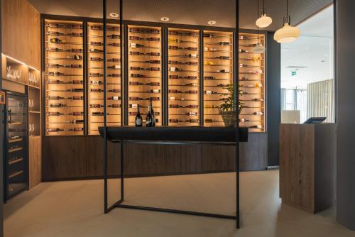 a wine cellar with a wall of wine bottles at Aldiana Club Salzkammergut und GrimmingTherme in Bad Mitterndorf