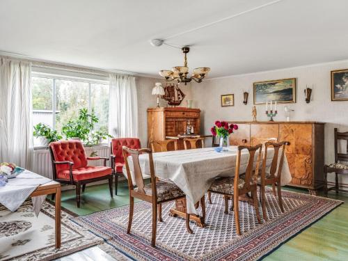 a dining room with a table and chairs at Holiday Home Källehult by Interhome in Tingsryd