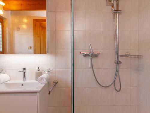 a bathroom with a shower and a sink at Holiday Home Chalet Mirabelle by Interhome in Nendaz