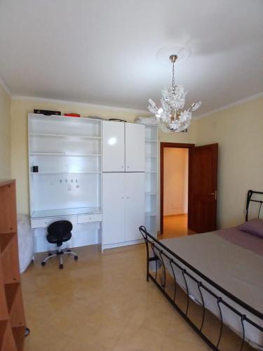 Letto o letti in una camera di Elegante Appartamento - 20 minuti da Napoli centro