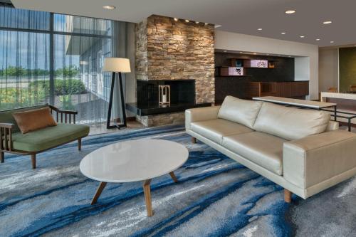 a living room with a couch and a table at Fairfield Inn & Suites by Marriott Moncton in Moncton
