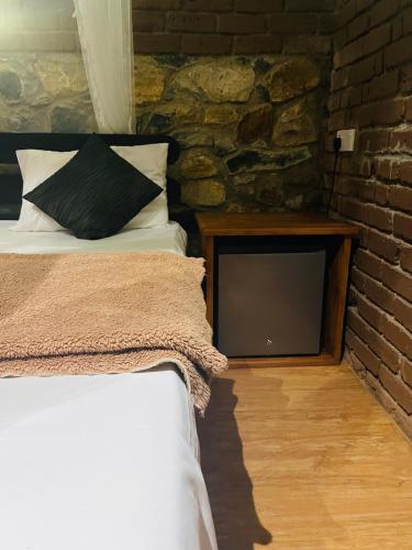 Postel nebo postele na pokoji v ubytování Wild Resort Ella