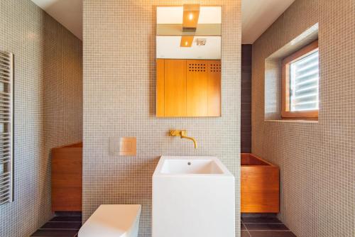 a bathroom with a sink and a toilet at Fog Signal Building by Bloom Stays in Littlestone-on-Sea