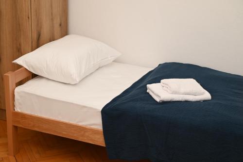 Ένα ή περισσότερα κρεβάτια σε δωμάτιο στο Apartmani Timacum