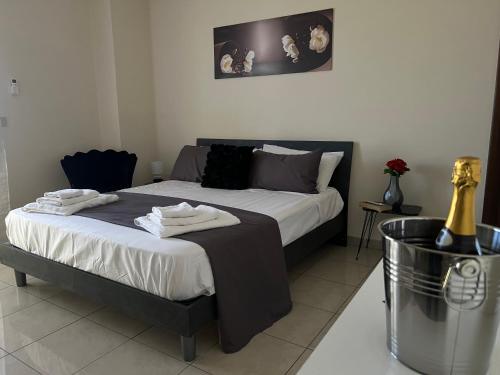 a bedroom with a bed with towels on it at Incanto B&B in Reggio Calabria