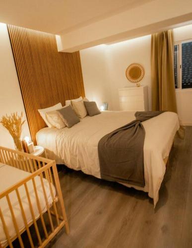a bedroom with a large bed in a room at Slowing Villas - Villa Âncora in Porto Santo