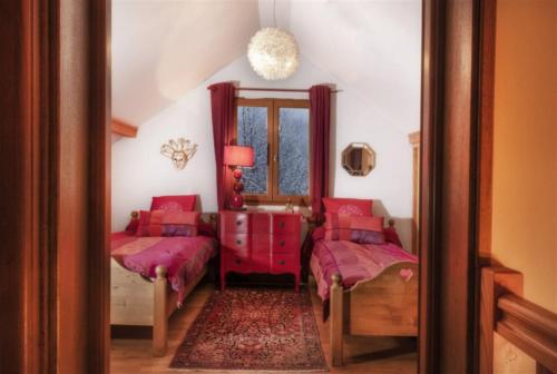 Postel nebo postele na pokoji v ubytování Chalet l'Orée du Bois