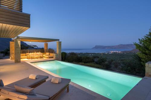 a swimming pool in a villa with a view at Youphoria Sea View Villas in Kissamos
