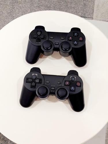 two video game controllers sitting on top of a table at Desaru COJY Homestay KTV GAME CONSOLE upto 14pax in Bandar Penawar